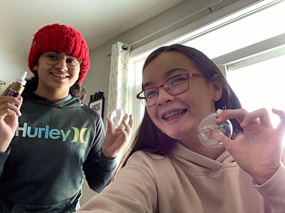 Summer and Aditi making Christmas ornaments