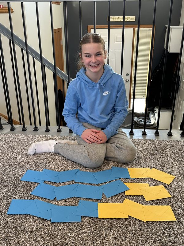 A New Prague student with handmade items from her Benjamin Project